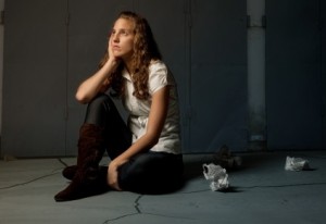 11682353 - sad lone girl sitting on flor in darkness